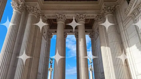 Classical Colonnade Against Blue Sky