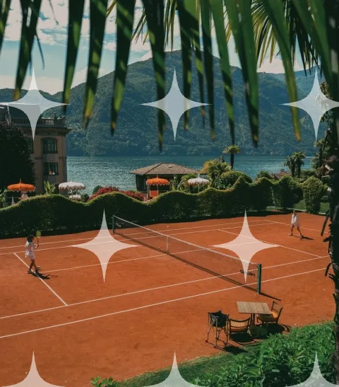 Clay Tennis Court Above a Lake
