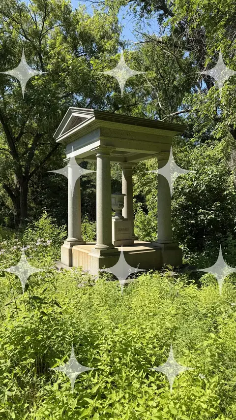 Colonnaded Tomb Among Wildflowers