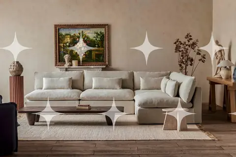 Cream Sofa Below a Gilt Landscape