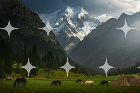 Horses Grazing Below Snow Peaks